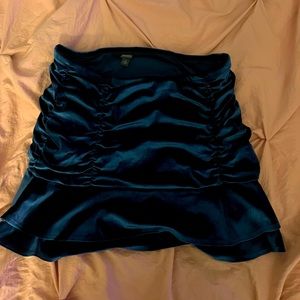 A blueish green velvet skirt!